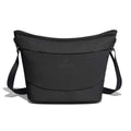 Black Hydro Flask insulated tote cooler bag with wide curved top, smooth exterior, rugged lower panel, adjustable shoulder strap with plastic hardware, and centered logo.